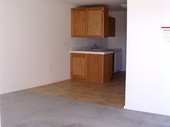 Living room leads to kitchen and bed rooms