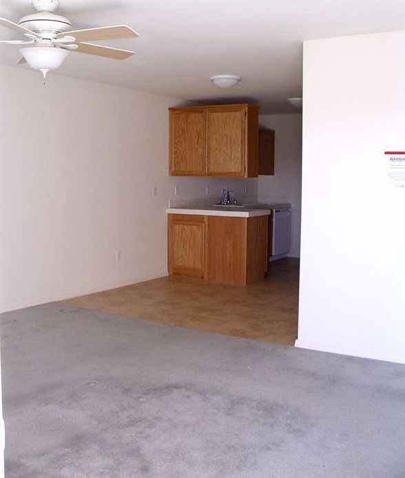 Living room leads to kitchen and bed rooms