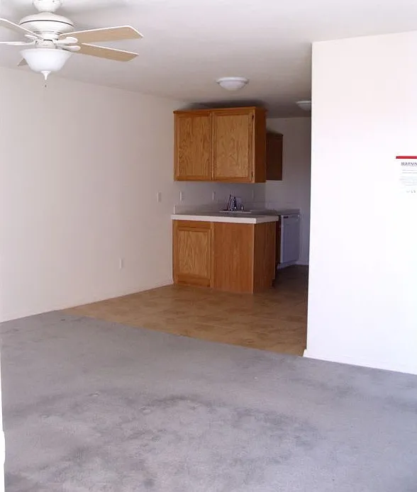 Living room leads to kitchen and bed rooms