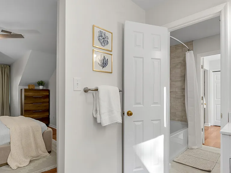 entry to shared shower/tub and toilet in adjoining Jack n Jill bathroom upstairs