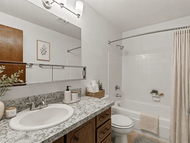 Full bathroom with spacious vanity and tub-shower combination Full bathroom with spacious vanity and tub-shower combination