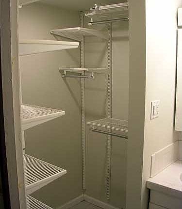 Large closet with Elfa storage system.