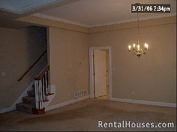 dinning area with staircase leading to upper bedroom, full bath, walk-in closet, storage room