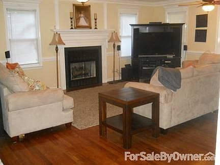 Living Room
						:
						Living room has custom molding, hardwood floors and a gas log fire place.