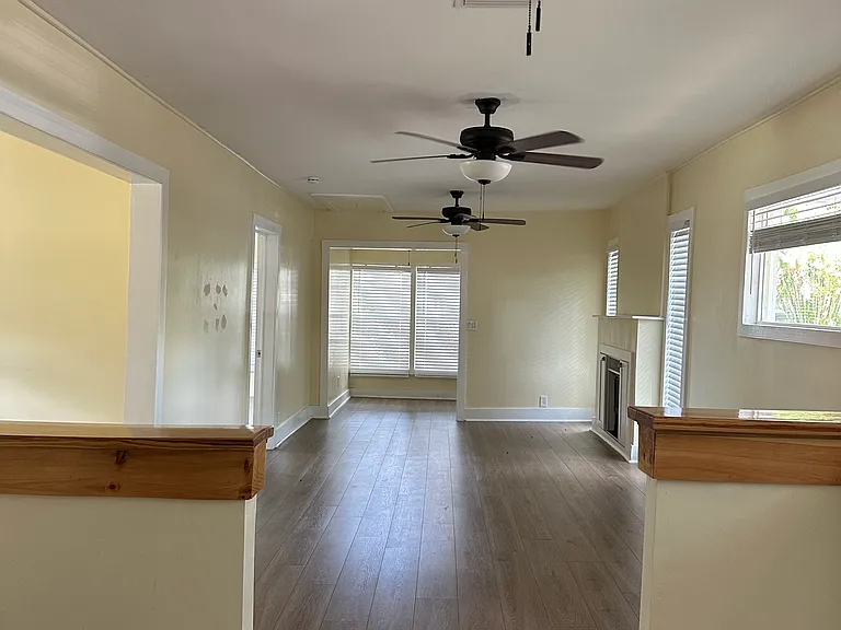 Open floor plan with many windows for natural light.