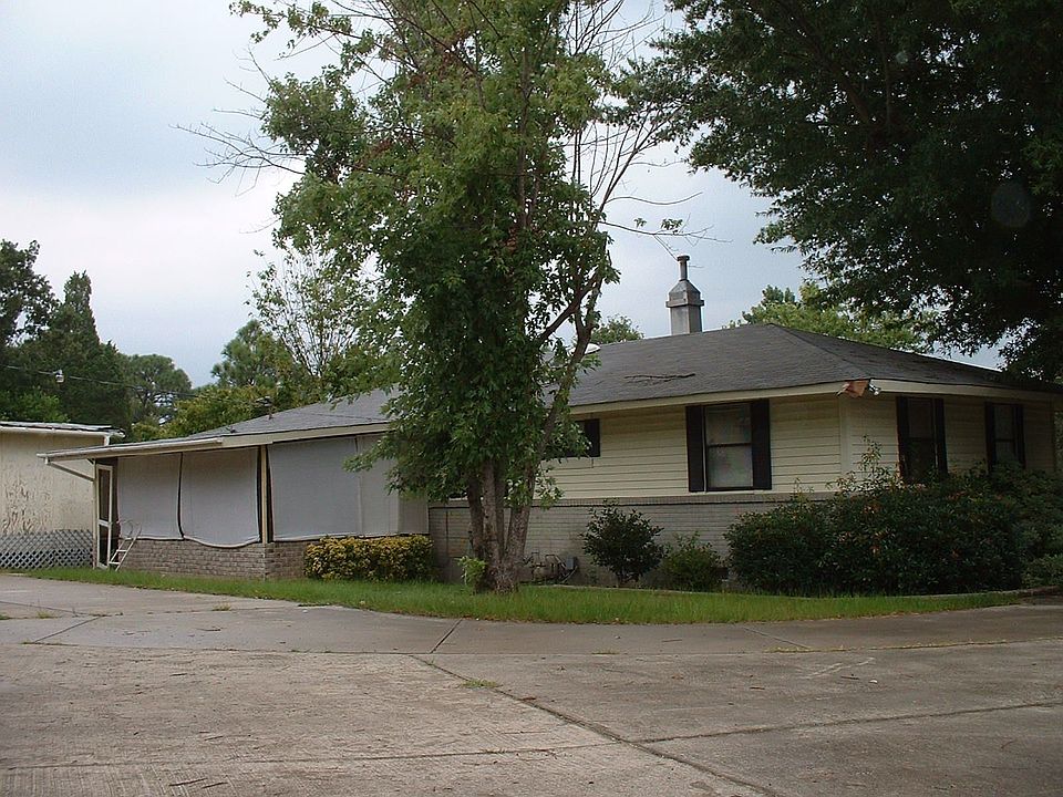 main home & backyard taken from 3-car garage, before wheelchair ramp was built