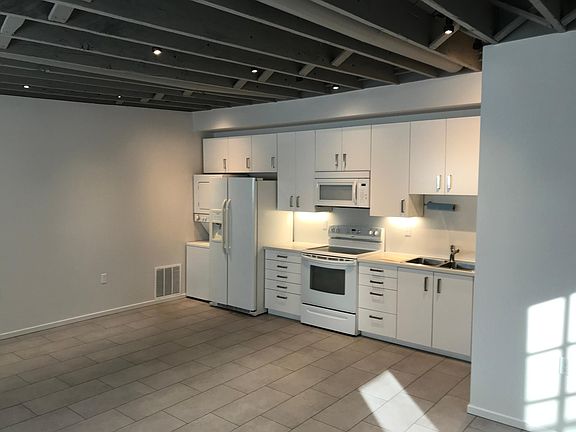 Open plan with exposed ceilings