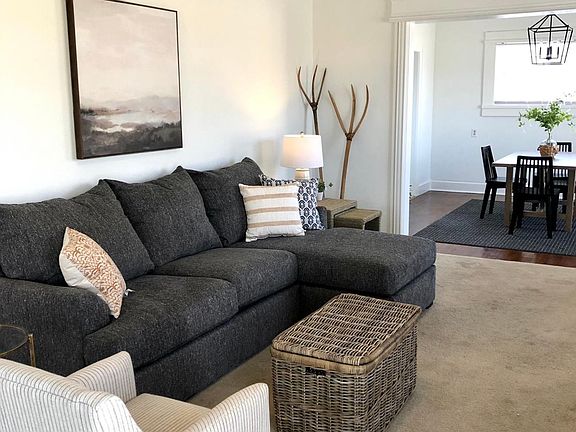 Huge living room with 9 foot ceilings and new luxury modern furnishings!