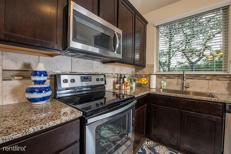 Chef's dream kitchen...lots of cabinets, granite counters AN