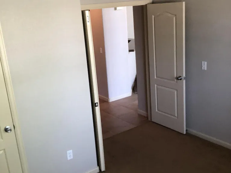 From the office, looking out double doors towards the kitchen.