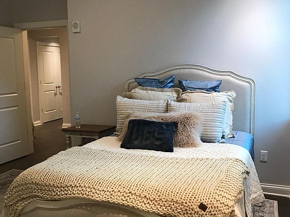large master bedroom with natural light and walk in closet