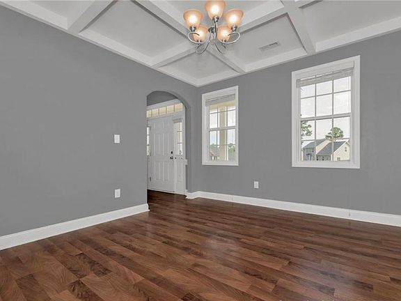 Beautiful dining room with coffered ceilings.