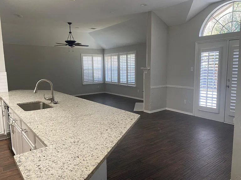 Eat-in kitchen with french doors to the back yard. Wood shutters throughout the home.