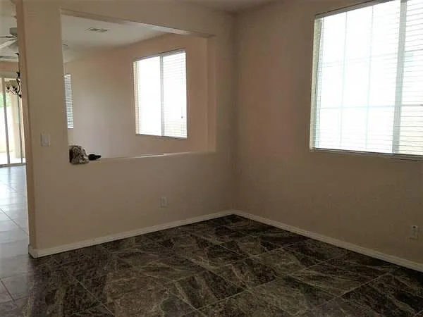 Living room and dining room divided by pony wall
