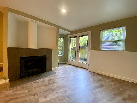Living room looks out onto private secured patio.