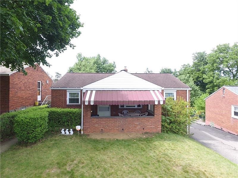 Level Entry Brick Ranch on Nice Sized Lot offering a 1 Car Integral Garage PLUS a Detached Garage