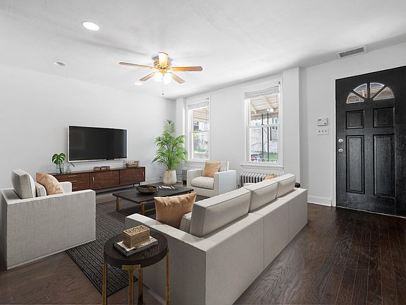 Living Room With Newly Refinished Walnut Hardwood Floors and Recessed Lighting!
