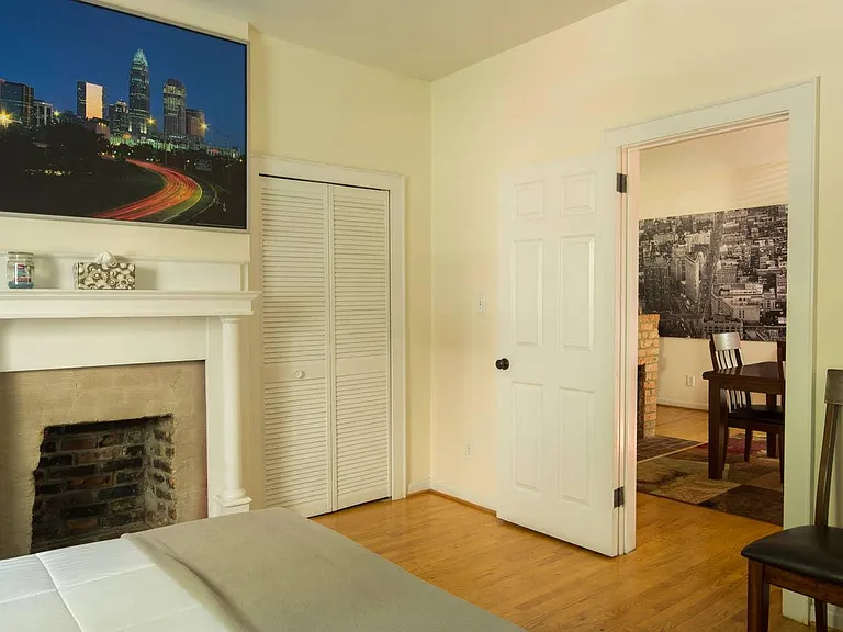 Master bedroom. One closet shown, a second closet to the left of the fireplace.