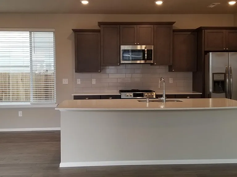 Huge area for a dining set adjacent to the kitchen.