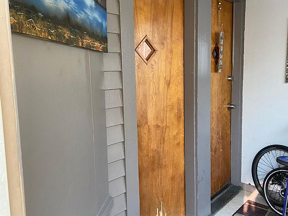 Veranda. Unit 1 is the door to the left.