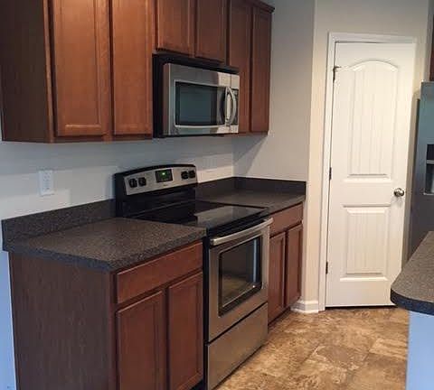 Kitchen with pantry and island, stainless steel smooth top o
