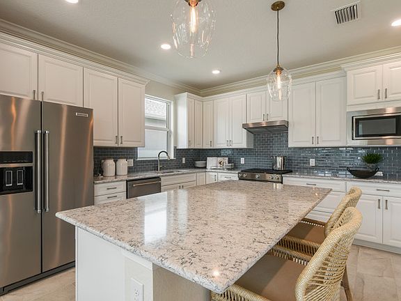 Gourmet kitchen with large center island, great for entertaining