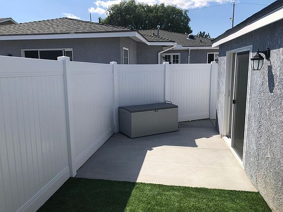 Private yard accessed by sliding door. Storage box.