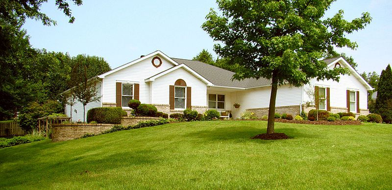 From the Street
						:
						Large front yard slightly slopes to the left. Mature front yard trees.