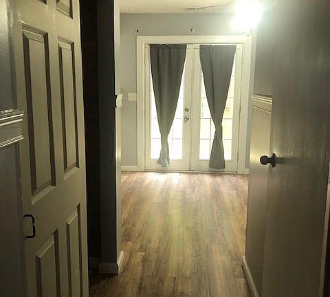 Hallway view, left closet to your left and entrance to bathroom to your right
