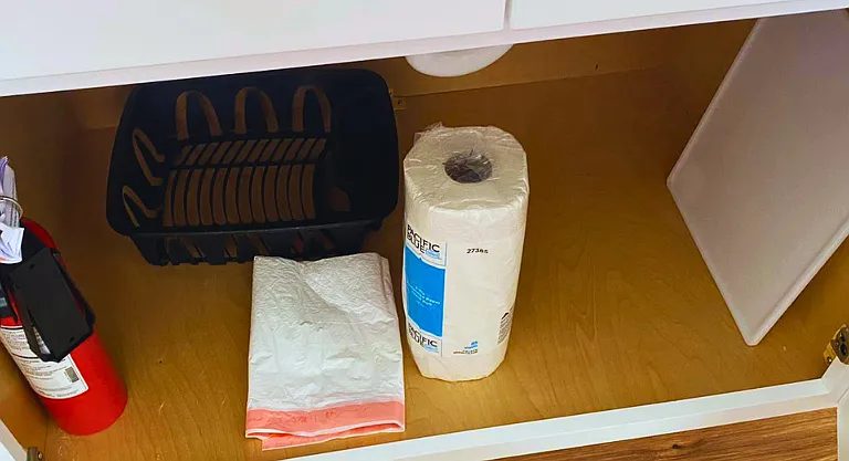 Equipped with cutting board, fire extinguisher, plastic bags, and disposable paper towels.