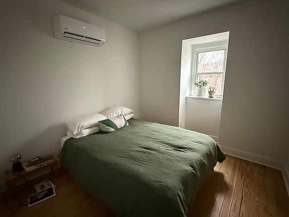 Bedroom with window and closet