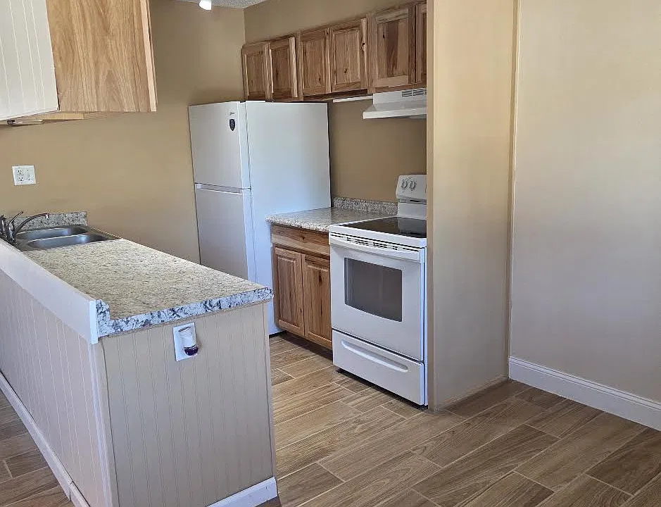 Kitchen has new refrigerator and nearly new stove which makes meals easy.