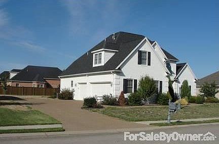 Side view with 3 car garage