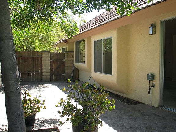 exterior side patio area from rear yard