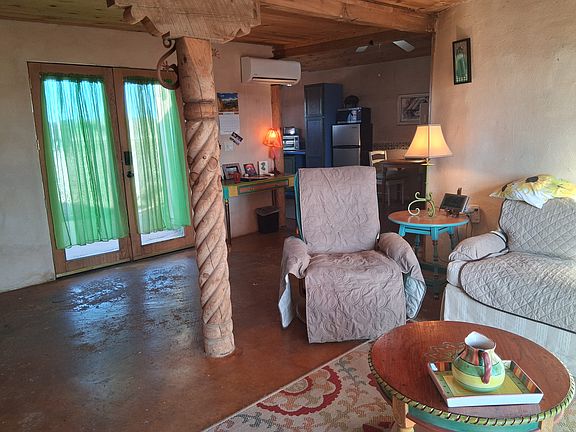 View to Entrance (L) and kitchen