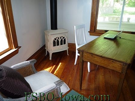 Living room/study w/ Jotl gas Franklin stove and built-in bookcases. This room was used by previous 