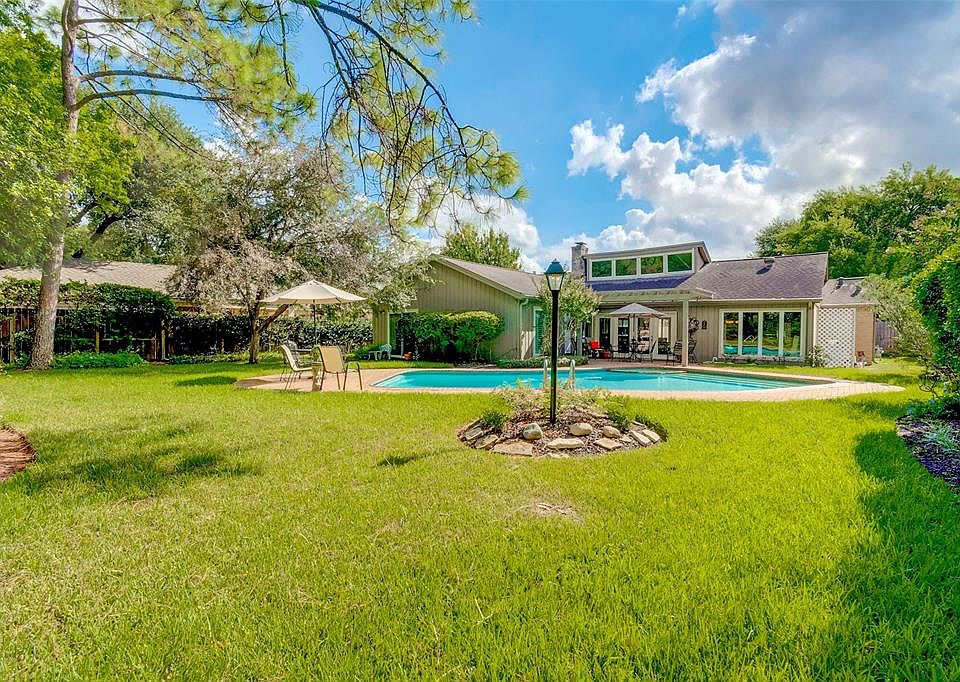 A look inside the secret oasis at 1914 Triple Oak Court which features a beautiful pool! The large yard has mature landscaping along with intimate seating areas scattered throughout. This is a special house and it's even better than the pictures! Com