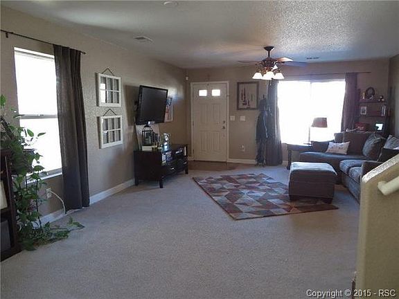 Living Room Has A Ceiling Fan