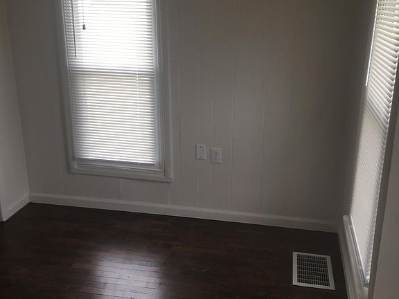Bedroom with thermal pane windows and new hardwood floors.