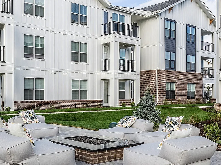 Nese's communal spaces include a cozy outdoor lounge with a firepit.