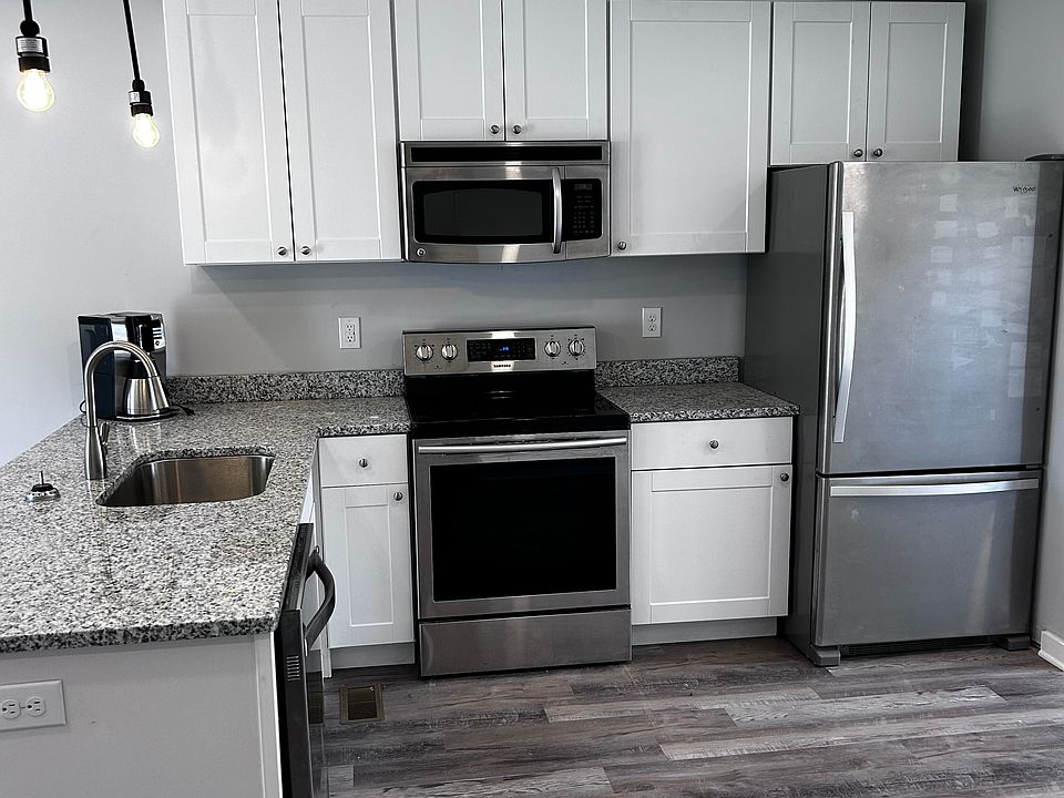 All stainless and granite, plenty of cabinets