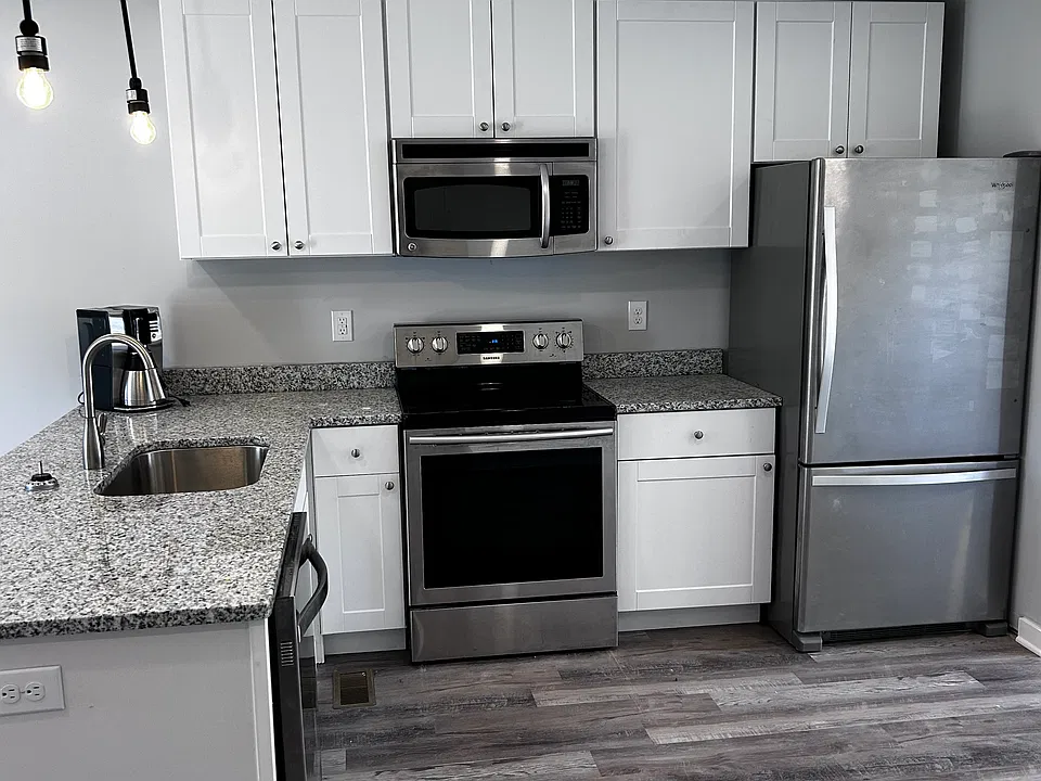 All stainless and granite, plenty of cabinets