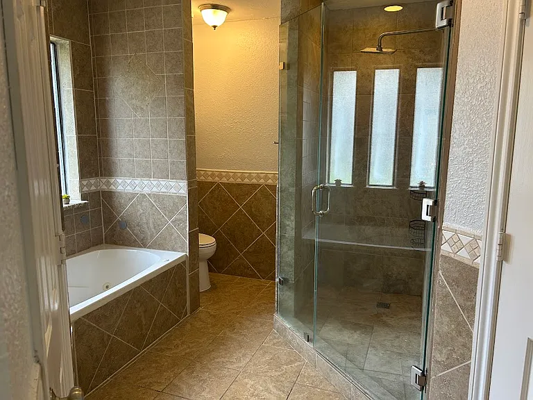 Master bathroom with tub and shower.