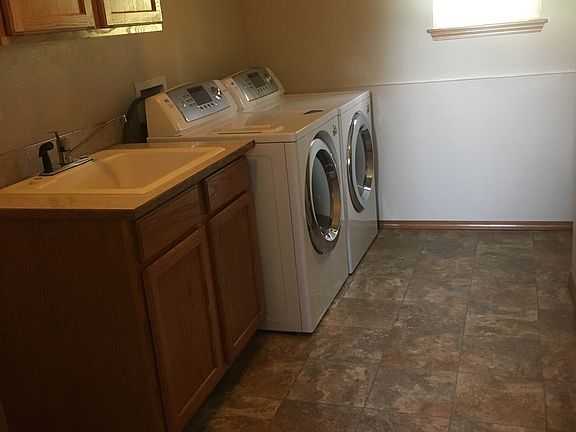 Laundry room with toilet 