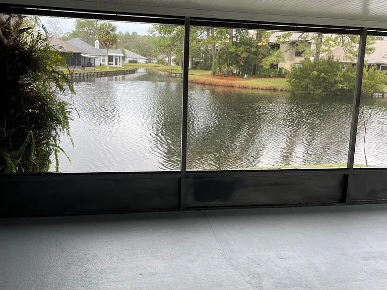 The best part of this home is the private screened patio and beautiful lake views!
