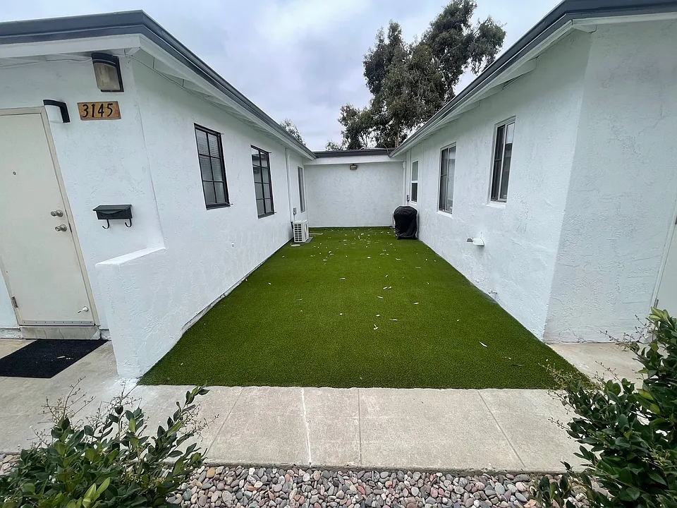 Large Turf Area for relaxing and great for pets. Soon to be split in half and we will include the gated and fenced area in your rent