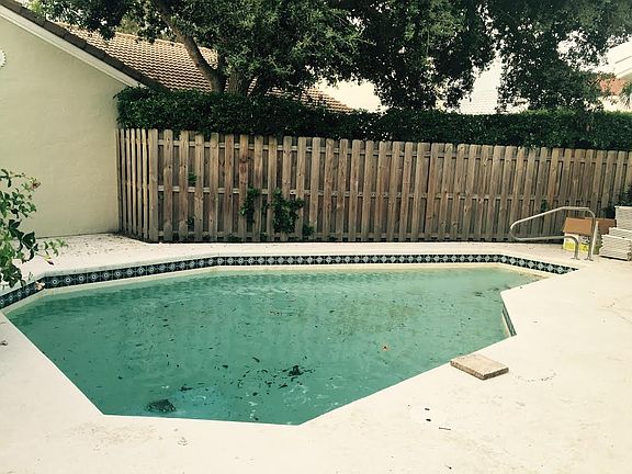 pool with fenced yard