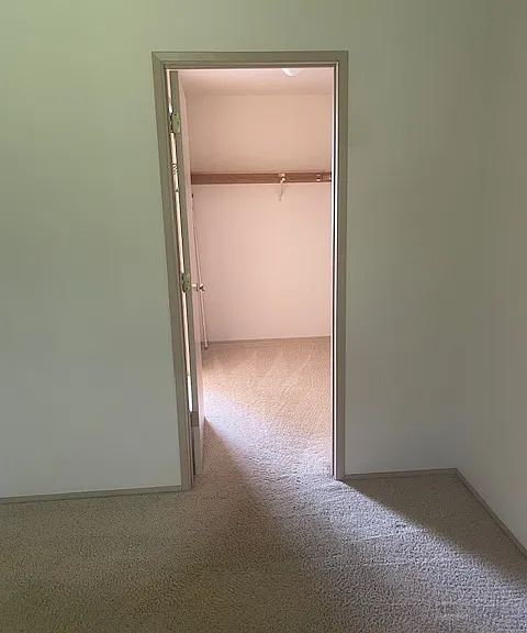 Walk-through closet from primary bedroom.