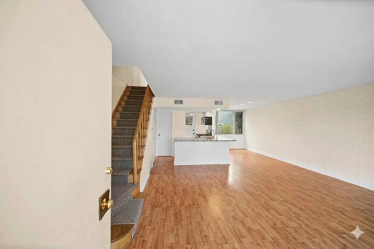 Beautiful large windows allow light to pour in. Exposed brick. Laminate flooring throughout. - 677 Roger Williams Ave