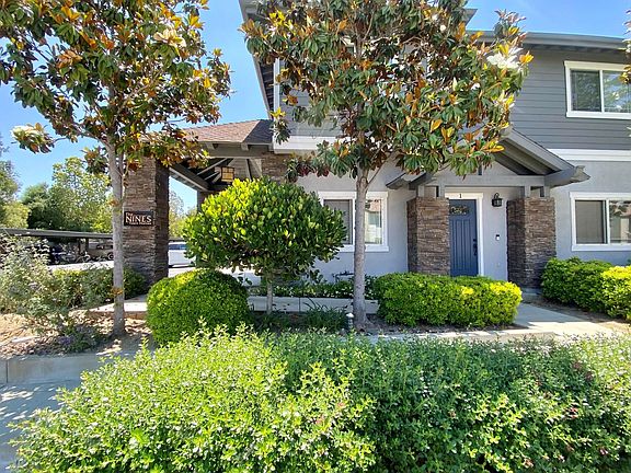 Beautifully landscaped enterance to The Nines Townhomes in Escondido, California.